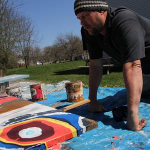 Eric Leppanen, with paints, outside his home in Belfast. (Photo by Wes Sterrs)