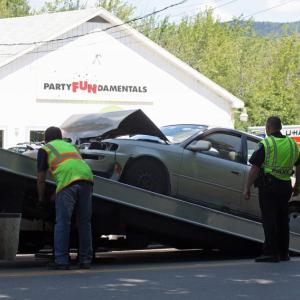 A Camden Exxon tow truck picks up Patty Freeman's Toyota sedan after she rear-ended another vehicle on Elm Street Wednesday afternoon. (Photo by Holly S. Edwards)