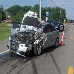 A minor was driving this Audi sedan when he crashed into the back of Rein Green's Toyota pickup truck.