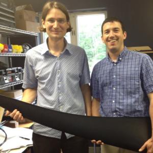 Ben Polito and Joshua Kaufman, with a wind turbine blade.