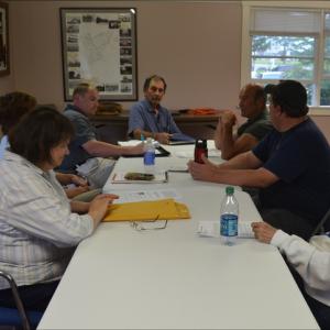 The Owls Head Volunteer Fire Company Board of Directors, from left around the table: Selectman Nancy Colson, Selectman Linda Post, Selectman Dick Carver, Fire Department volunteer Andy York, Company President Tim Sternberg and Company Treasurer May Grant. (Photo by Lynda Clancy)