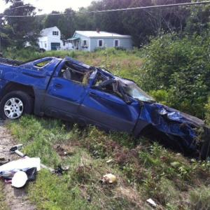 Jennifer Lambeth's Chevrolet Avalanche sits in a ditch after Saturday's accident on Back Searsport Road in Belfast.