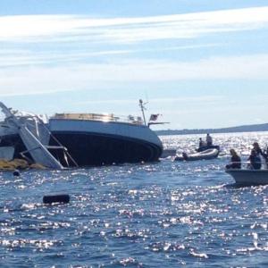 The Archangel lost its mast when it crashed into East Goose Rock, off Lasell Island this afternoon, grounded out, and rolled onto its side. (Photo courtesy Leonard Lookner)