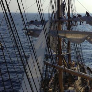 Crew climb high into the 147-foot tall masts of the Eagle to unfurl the sails before hoisting them. (Photo by Boatswain’s Mate Shelbie Smart)