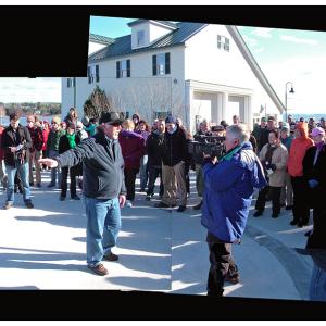 City Planner Wayne Marshall addresses a large crowd outside the Belfast Boathouse at the Harbor Walk grand opening, Nov. 9. (Photo by Ethan Andrews)