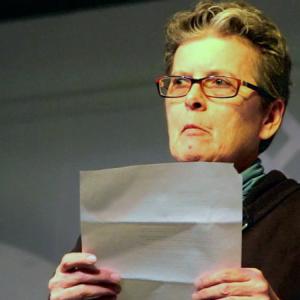 Laurence Coe of Rockland reads one of her poems at the Playhouse Theater in Belfast, Nov. 22. A small turnout at the bi-monthly poetry slam led to the creation of an all new event. (Photo by Wes Sterrs)
