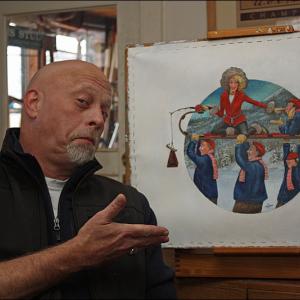 Graphic illustrator and artist Ben McGinnis of Hope with the original painting for the 2014 U.S. National Toboggan Championships poster, T-shirt and event guide cover. He spent months painting it, in his free time, on this easel in his kitchen, moving a chair from the table to the easel and swiveling a ceiling light over for the detail work. (Photo by Holly S. Edwards)