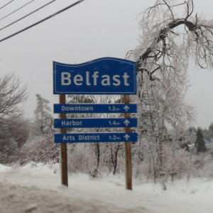  The welcome sign featured entering Belfast via Route 3 sits encrusted in ice Monday afternoon. 