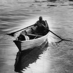 Phil Raynes rowing in his skiff. (Photo courtesy of Capt. Gilbert Hall)