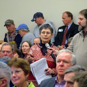 Nancy Galland of Stockton Springs addresses a panel of federal and state representatives at a public information meeting on a proposal to expand the cargo ship channel in Searsport. A number of Midcoast residents attended the meeting in Bangor, Monday night. (Photo by Ethan Andrews)