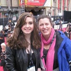 Emma Silverton and Jessica Manbeck pose for a photo from the red carpet bleachers outside the Dolby Theatre at last Sunday’s 86th Academy Awards and Oscars in Hollywood, Calif.