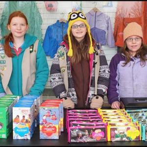 Chilly weather didn’t deter Erin Corcoran, 11, of Rockland; Grace Young, 10, of Thomaston; and Melissa Leonard, 10, of Warren from selling Girl Scout cookies at Reny’s Plaza in Camden Saturday afternoon, March 22. (Photo by Chris Wolf)