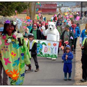 The Belfast Earth Day parade passes through Heritage Park on Tuesday. (Photo by Ethan Andrews)