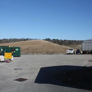 By the end of the day Saturday, April 12, Mid-Coast Solid Waste Corp. staff will have moved the transfer station’s recycling bins, left, and tucked them up against the building and big rig trailer on the right. If you don’t have to recycle next week, it would be better to put it off while drilling operations are underway next week, April 14-18. (Photo by Holly S. Edwards)