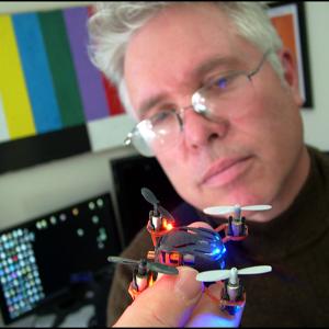 Belfast Community TV Station Manager Ned Lightner with a toy quadcopter, similar in design to (but much smaller than) the one he and BCTV contributor Mark Kuzio bought to give viewers of the public access channel a bird’s eye view. (Photo by Ethan Andrews)