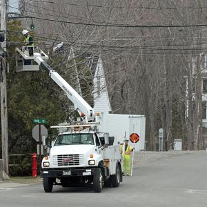 Line crews have been working the past few weeks throughout Rockport Village, stringing fiber optic lines to initially serve the town office, Maine Media College, and Rockport Public Library buildings. (Photo by Holly S. Edwards)