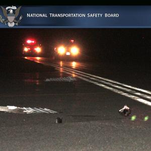 Debris and parts from the collision of 1994 GMC Sonoma pickup truck with the private Cessna airplane on runway on the night of Nov. 16, 2012. The pilot and two passengers were killed in the crash, after which the airplane caught fire. The truck’s driver was uninjured. (Photo by Holly S. Edwards)