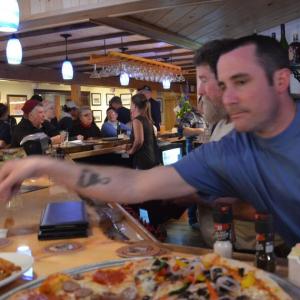 Brewmaster Ben Hazen tends to a full bar May 1 at Andy’s Brewery. (Photo by Lynda Clancy)
