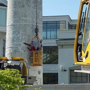 Inspectors check out the Knox Mill smokestack Tuesday morning in downtown Camden. (Photo by Chris Wolf)
