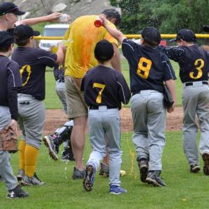 Fisher players, including Jason Leclerc, Ryan Lewis, Parker Hilchey, Jude Forti, Carson Murphy and Austin Pagano, among others dump bottles of Gatorade on manager John Murphy in the post-game celebration. (Photo by George Harvey)