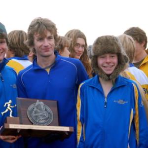 Coach Nick Scott with state champion cross country runners Nate Schwehm (left) and Chase Brown (right) after winning the BRHS team’s first state title. Courtesy of Nick Scott. Photo of Nick Scott, Nate Schwehm and Chase Brown