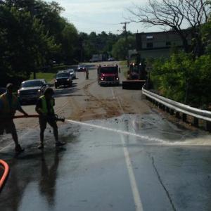 Rockport firefighters spent the morning June 30 cleaning chicken manure off of Route 17. (Photo courtesy Rockport Fire Department)