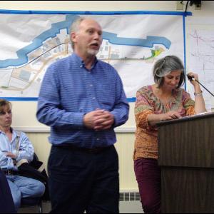 Belfast City Planner Wayne Marshall, center, answers a question posed by a City Council member about current zoning on Seaview Terrace. Behind him, residents of the street, Kathleen Kearns, right, and Laurie Allen wait to address the Council. (Photo by Ethan Andrews)