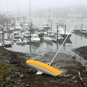 The 24-foot sailboat Kohiki lays in the mud at the head of Camden Harbor Thursday morning. (Courtesy Steve Pixley)