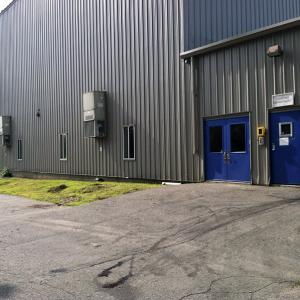 The side entrance to the former Coastal Farms and Foods facility showed subtle signs of life as the blueberry processing side of the facility this week under new ownership. (Photo by Ethan Andrews)