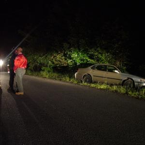 Firefighters from the West Frankfort Fire Department at the scene of a single car crash on Town Hill Road, Sunday night. (Photo by Ethan Andrews)