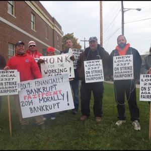 Local workers of IBEW Local 2327, Unit 6 stand the picket line in Rockland in front of the Fairpoint Communications building. (Photos by Chris Wolf)