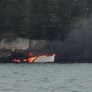 The 25-foot Midnight Rider burns in Hurricane Sound in destructive fire. (Photo courtesy Maine Marine Patrol)