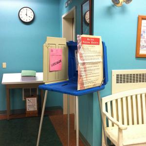 An absentee voting booth in the lobby of City Hall in Belfast, set up in advance of special school board elections, Jan. 13, for the newly-forming RSU 71. (Photo by Ethan Andrews)