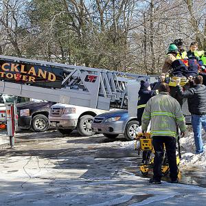 Rockland Fire and EMS personnel work to finish bringing an injured contractor off the Hannaford supermarket roof Saturday morning. (Courtesy Rockland Fire Dept./by Alan Athearn)
