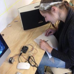 Trekkers student Jenny Carter designing and building a polargraph drawing machine at the Steel House in Rockland.