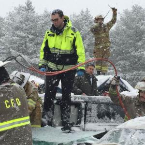Hermon Fire Capt. Chandler Corriveau helps direct firefighters, troopers and other first responders to check on the many motorists still inside their wrecked vehicles following Wednesday morning’s 75-car pile-up on I95 in Etna and Hermon. (Courtesy Maine Dept. of Public Safety)