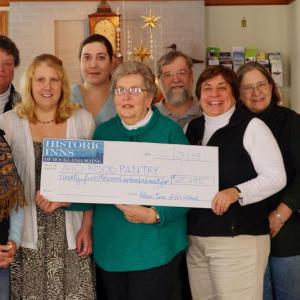 Participating business representatives from the 11th Annual Pies on Parade Pie Tour gathered at the Granite Inn to present a check for $25,695 to the Area Interfaith Outreach (AIO) Food Pantry and Fuel Assistance Program. Pictured here from left to right: Lynn Archer (Archer’s on the Pier), Pinny Beebe-Center (AIO), Kimberly Snow (Snowdrop Confections), Nicole Payson (FIORE Olive Oils and Vinegars), Linda Pieper (AIO), Edwin Hantz (Granite Inn), Cheryl Michaelsen (Berry Manor Inn), Joan Hantz (Granite Inn), PJ Walter (LimeRock Inn). Photo by PJ Walter.