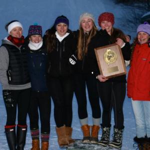 Several Camden Hills girls alpine skiers hold up the Class B girls runner up plaque. Pictured, from left, are Audrey Heriz-Smith, Samantha Zwecker, Molly Mann, Brynne Wrona, Renaissance Lyman and Katherine Dailey. Not pictured are Lydia Morin, Ella Simon, Raine Ellison and Abby Chamberlin. (Courtesy David Lyman)
