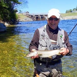 Fly-fishing for land locked salmon at the head of Grand Lake Stream, in the Dam Pond. (Courtesy GRTU)