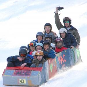 A group of people enjoy a previous Cardboard Box Derby at the Camden Snow Bowl. (Courtesy Camden Snow Bowl)