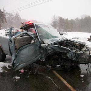 Cassandra Bean, of Alfred, lost control of her 1987 Dodge pickup Saturday evening, March 15, and crashed into the rear end of a Mack truck. (Photo courtesy Knox County Sheriff’s Office)
