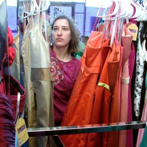 Heather Bryant, a volunteer with Cinderella Project of Maine, organizes formal dresses in preparation for the annual prom gown giveaway, to be held on April 4. (Photo by Ethan Andrews)