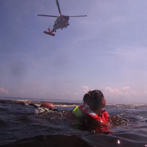 The Coast Guard practices hoist training, simulating a swimming rescue. (U.S. Coast Guard photo by Petty Officer 3rd Class David Weydert)