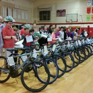 Student winners in the Bikes for Books program stand with their new mountain bikes. Photo by Sarah Shepherd