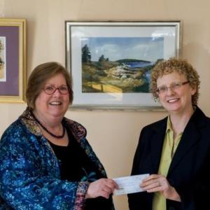 (L to R): Meg Klingelhofer, New Hope for Women’s community education director and Kathleen Morgan, New Hope for Women’s executive director receive a check from Kim Palermo and Karen Brace of the Midcoast Chapter of Maine Women’s Network. (Photo by Iveta Jurik)