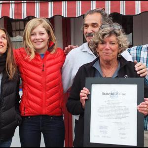 Meg Quijano (center) proudly display the proclamation given to her by state representative Joan Welsh. Behind her is her daughter Lisa Randall, granddaughter Yelena Randall, husband Paul Qiojano and grandson Oli Randall. (Photos by Chris Wolf)