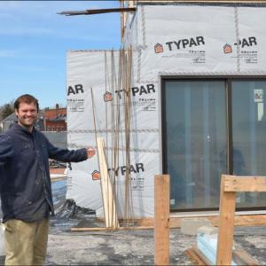 Tyler Smith, on the roof of 16 Bay View Street, soon to be a new hotel in town with 22 guest rooms. (Photo by Lynda Clancy)