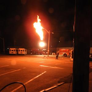 Rockland firefighters had to use a combination of water fog streams and ‘flaring,’ shown here, to disperse the propane vapors and reduce pressure to make it safe to drain the remaining liquid fuel and make repairs to the leak. (Courtesy Rockland Fire Department)