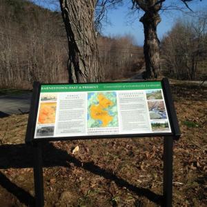 A new interpretive panel marks the Bald Mountain Preserve trailhead. (Photo courtesy Coastal Mountains Land Trust)