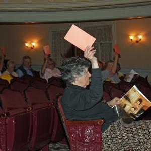 Camden voters raise their cards during the 2015 Town Meeting in the Camden Opera House June 10. (Photo by Holly S. Edwards)